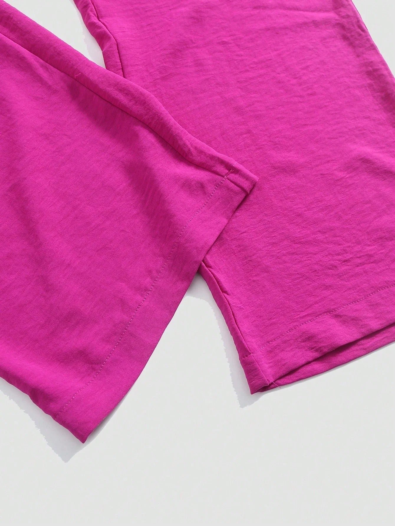 Urholkad plisserad jumpsuit med vida ben