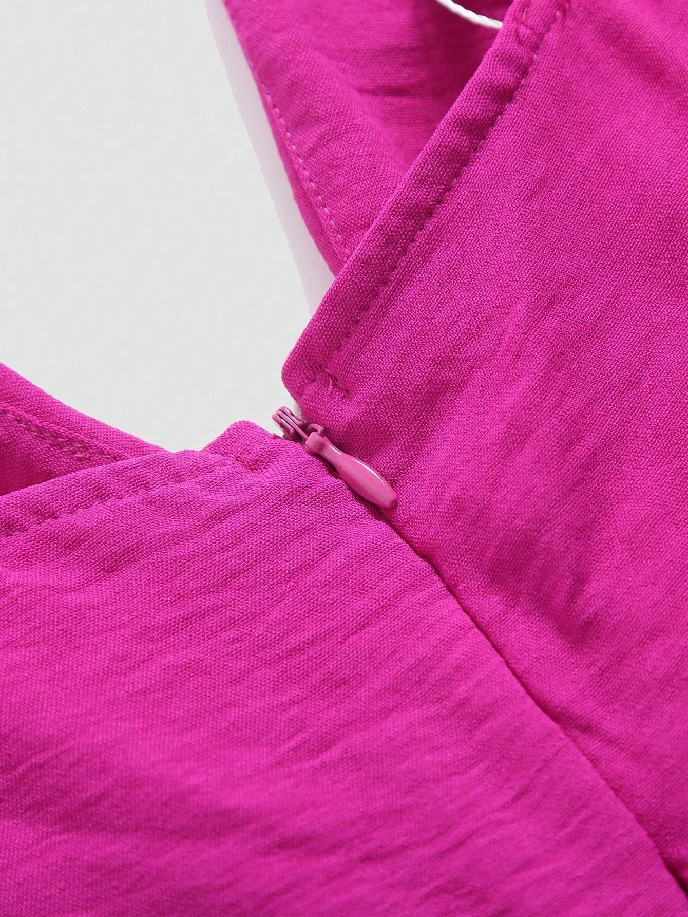 Urholkad plisserad jumpsuit med vida ben