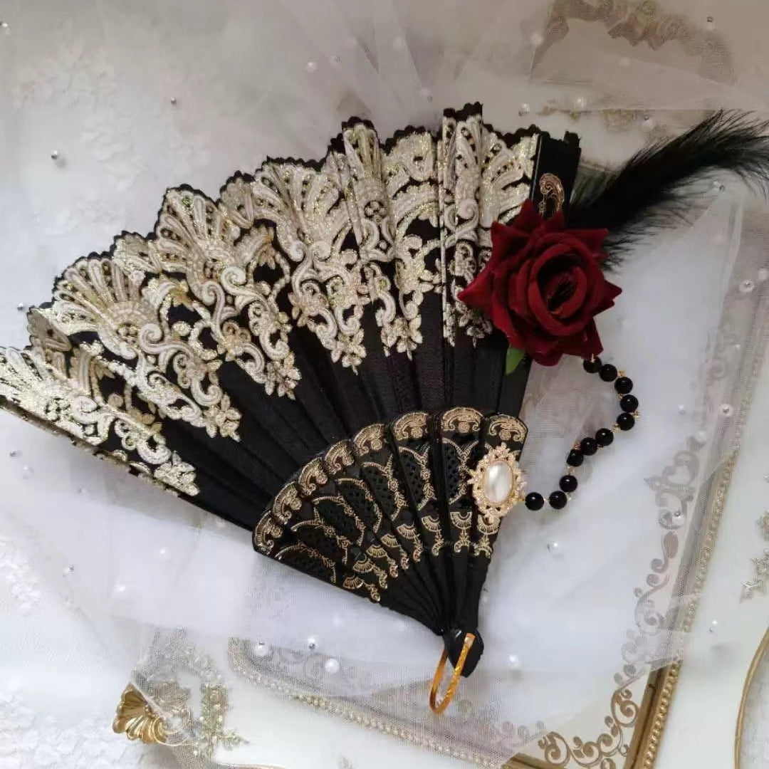 Damhandfläkt med invecklade dekorationer och vikbar design 1