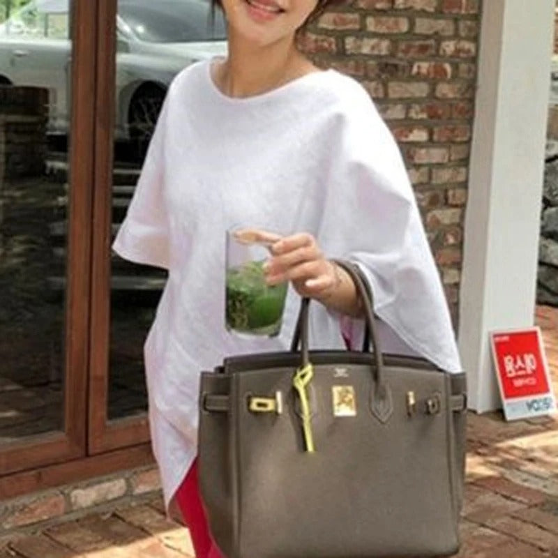 Asymmetrisk halvärmad blus för kvinnor